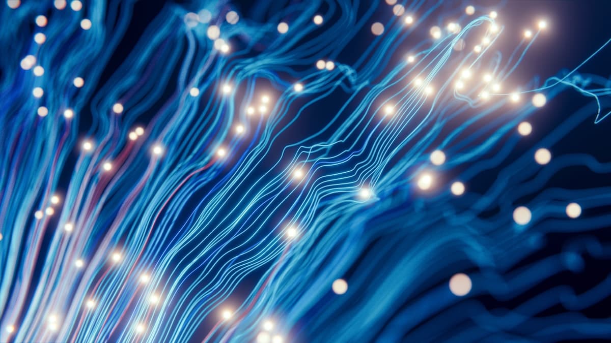 Streams of blue light filaments carrying points of data